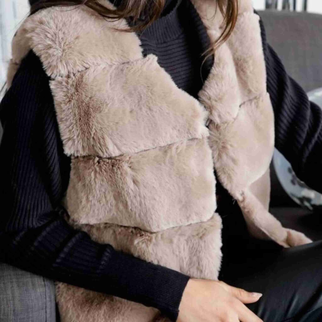 Faux Fur Vest Over Long-Sleeve Top